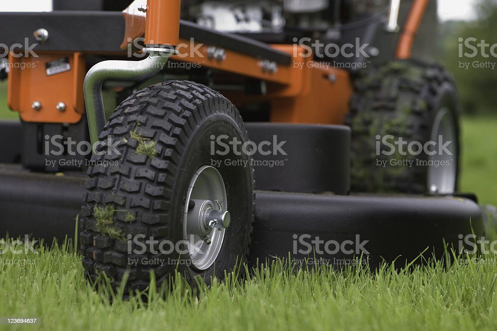 a-large-mower-sits-on-the-lawn
